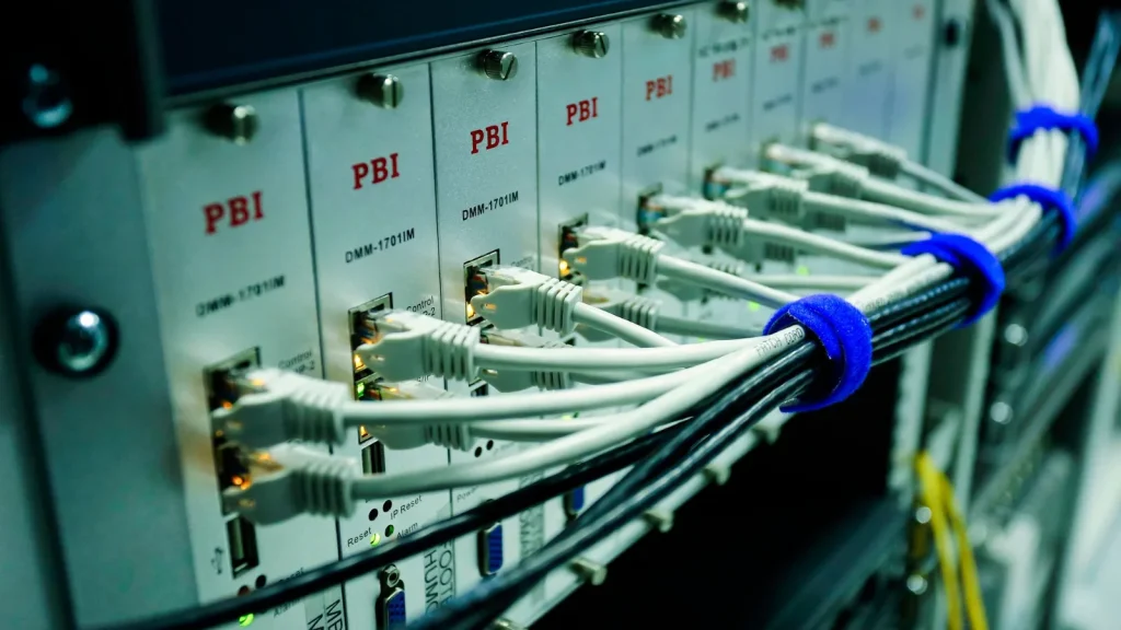 Ethernet cables connected to a network switch in an office network